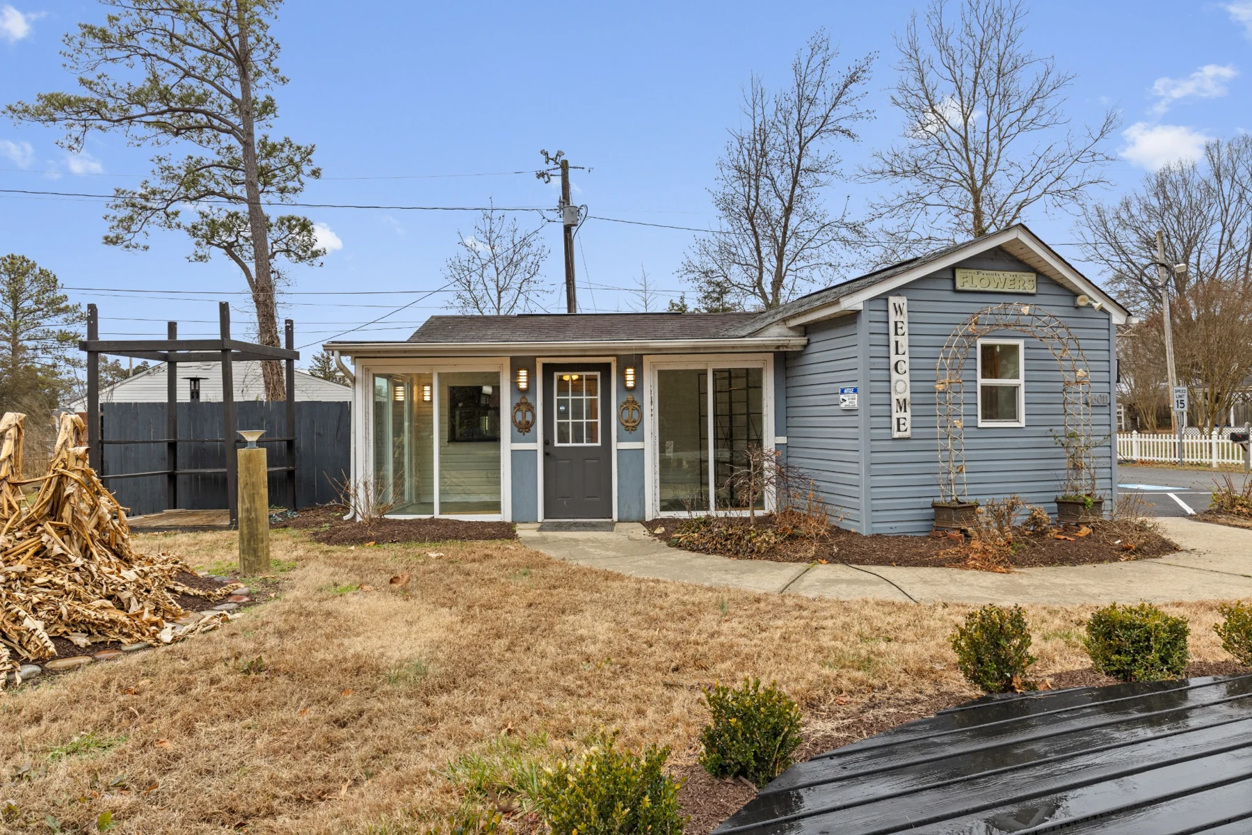The blue exterior of the property before renovations